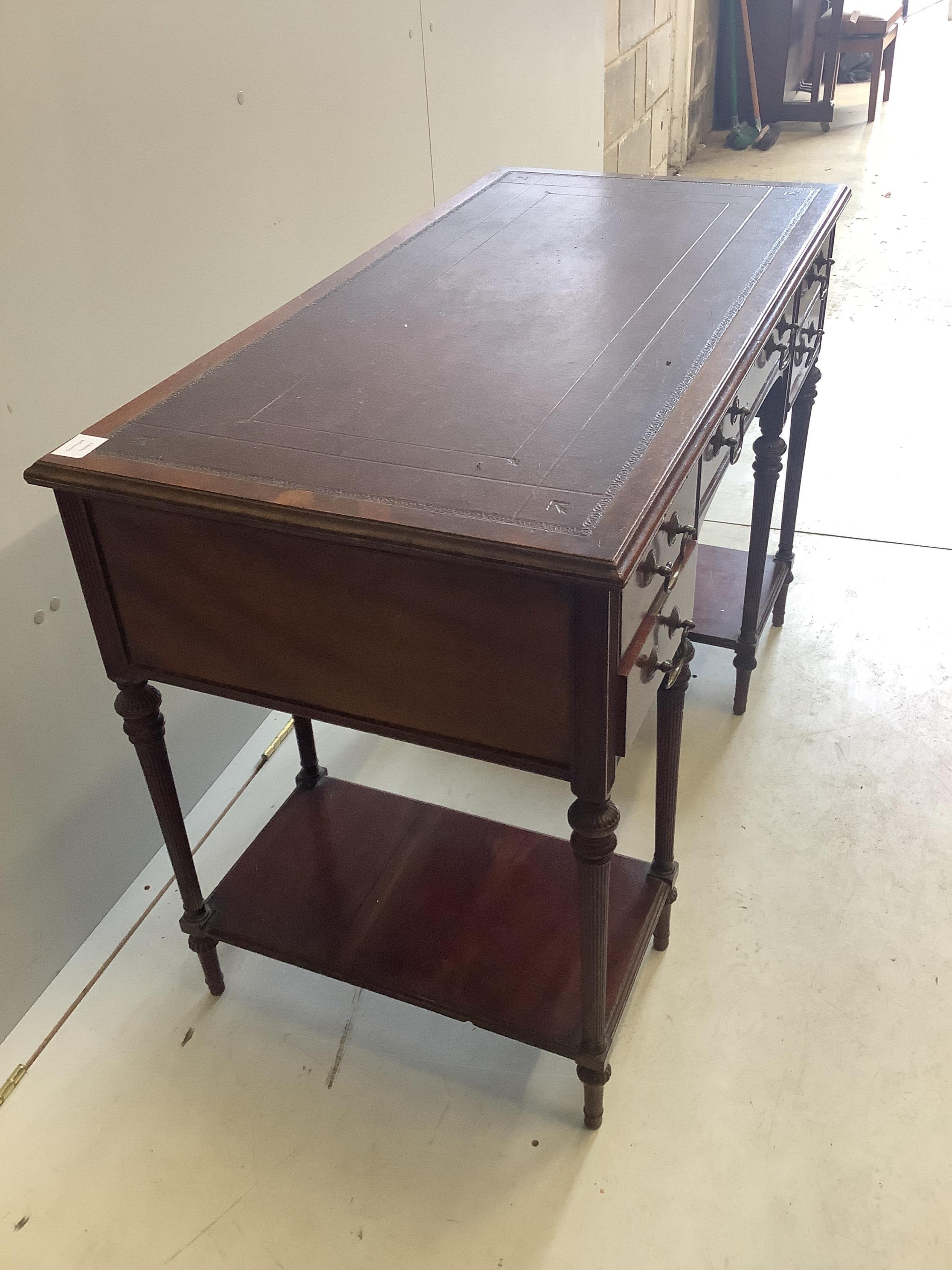 A late Victorian mahogany kneehole writing table by Collinson & Lock, width 109cm, depth 55cm, height 74cm. Condition - fair to good